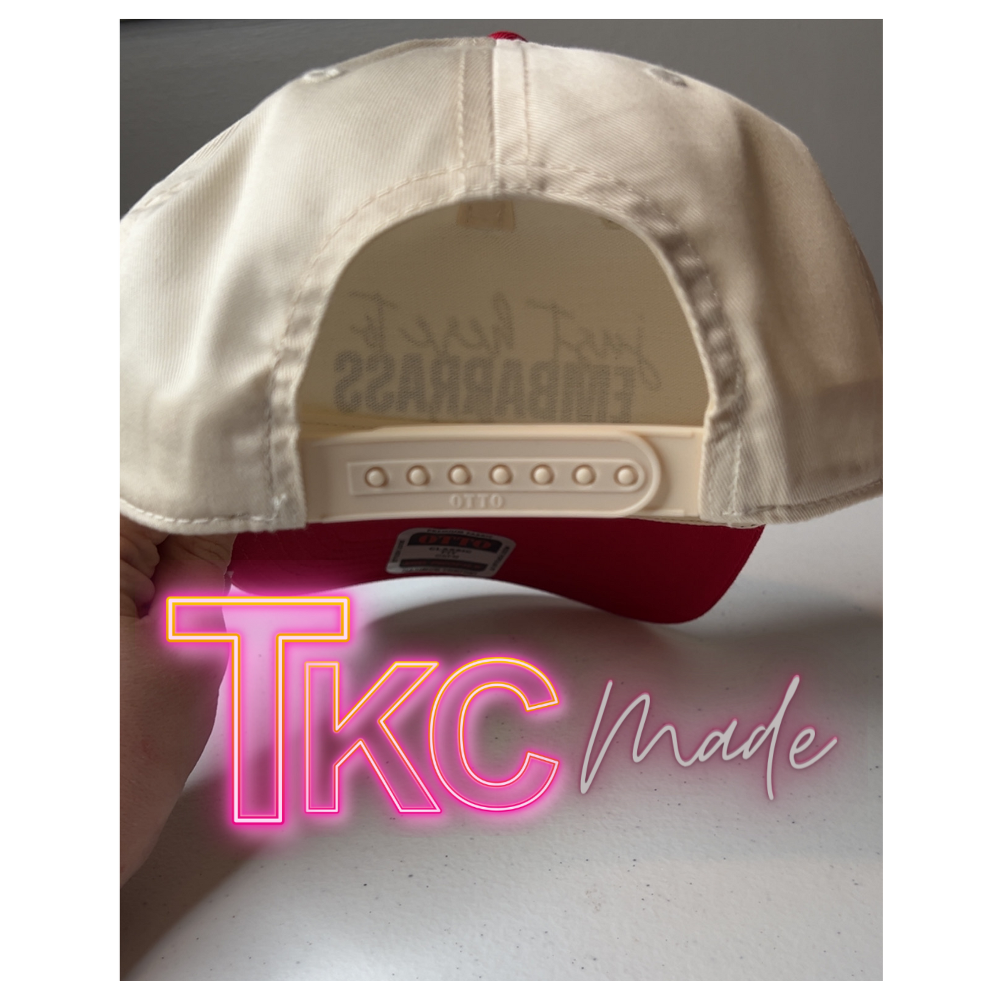 Beige and red cap with 'Era Bar B Que' branding on the back, held by a hand with 'TKC made' text overlay.