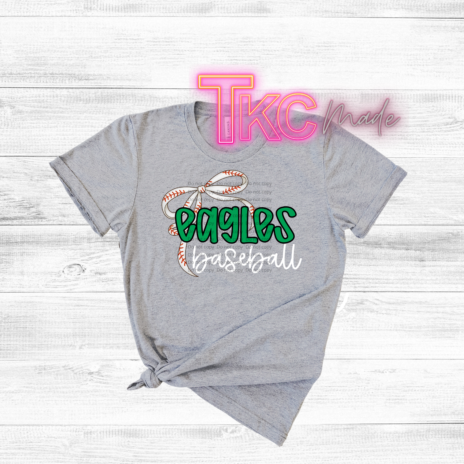Gray t-shirt with 'Eagles Baseball' design and 'TKC made' text on a white wooden background