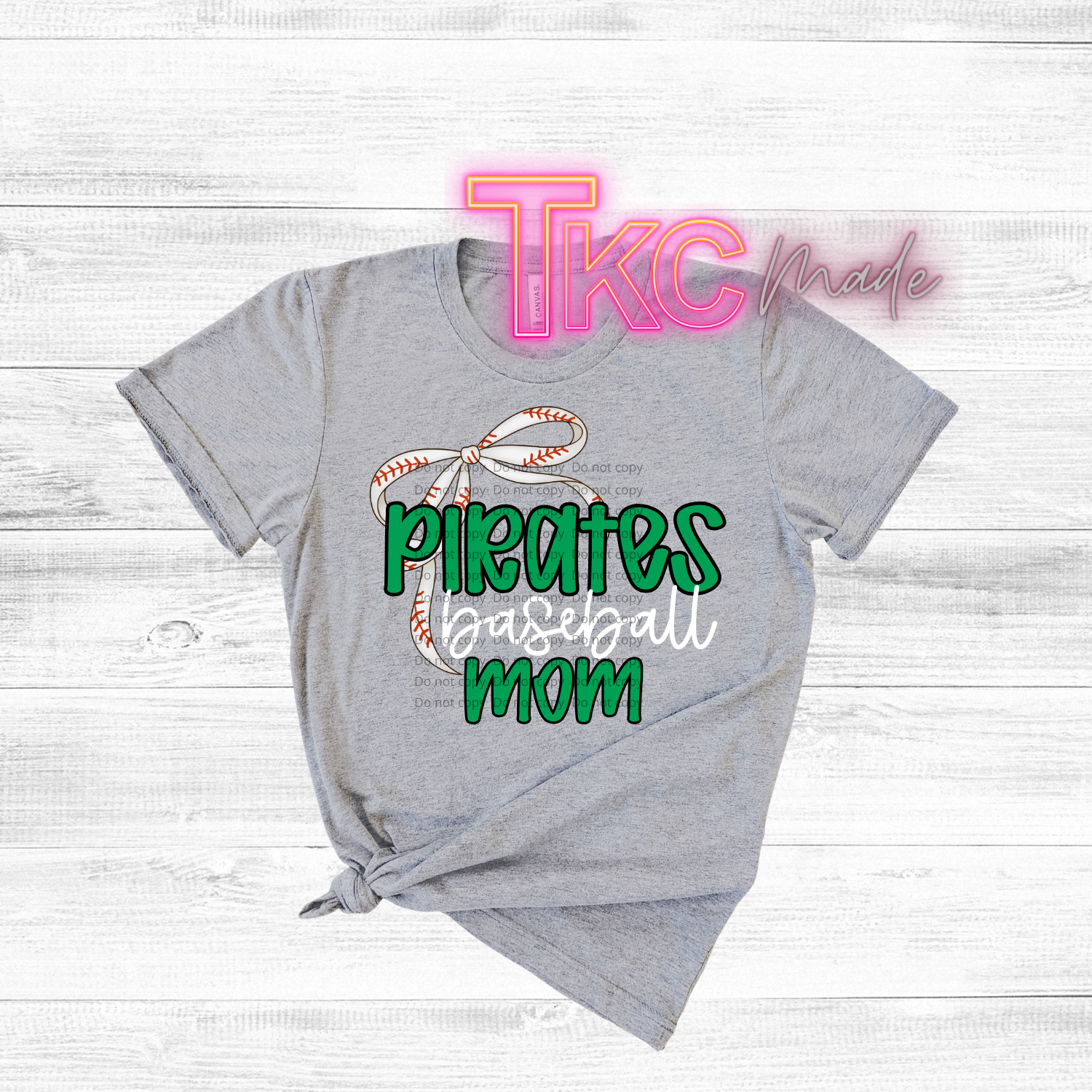 Gray t-shirt with 'Pirates Baseball mom' text and logo on a light wooden background