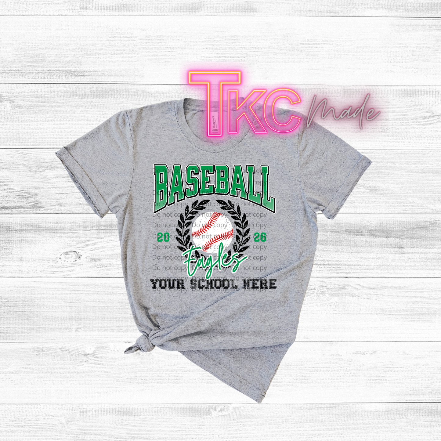 Gray t-shirt with customizable baseball design on a wooden surface, featuring 'TKC made' text.