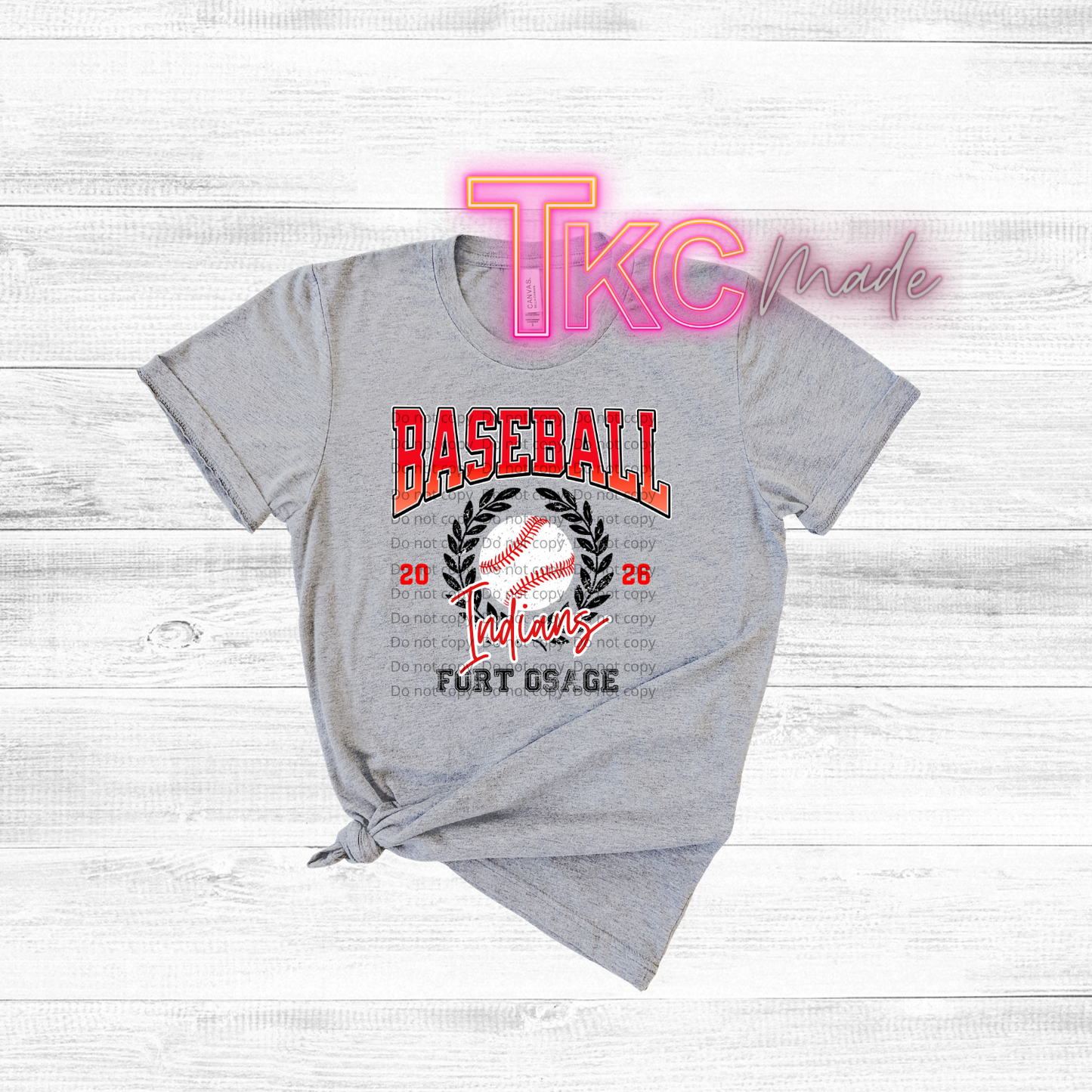 Gray t-shirt with 'Baseball' and 'Indians' text on a wooden surface, featuring 'TKC made' branding.