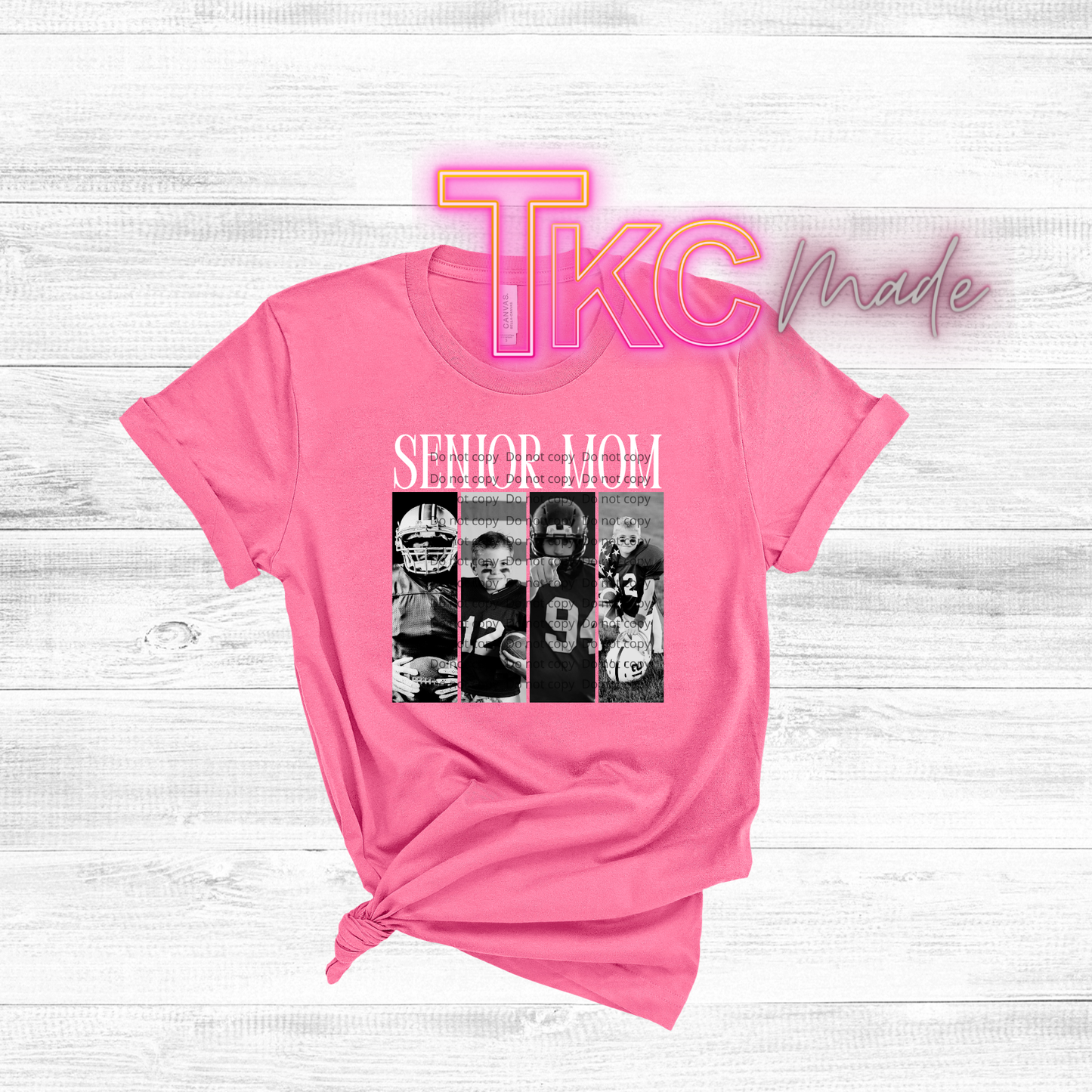 Pink t-shirt with Senior Mom and custom 4 picture design and 'TkC Made' branding on a light wooden background