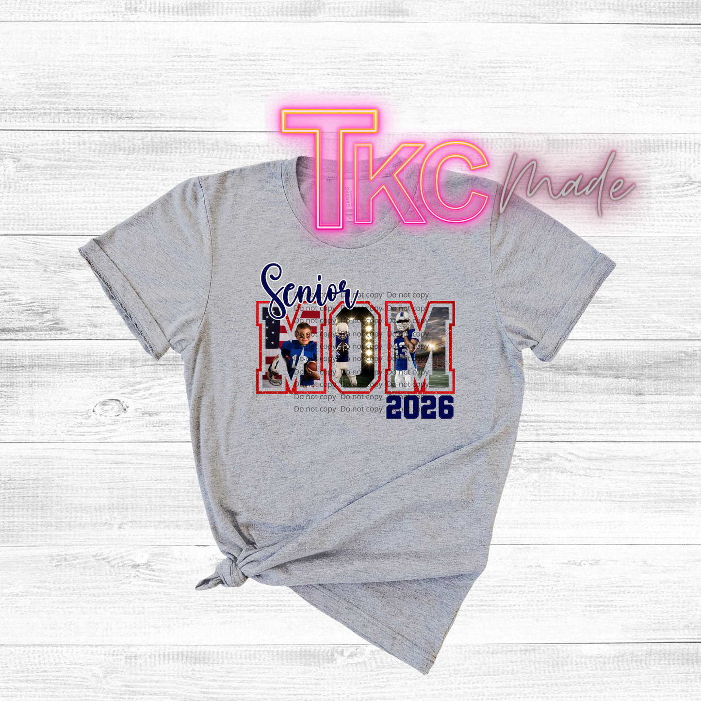 Gray t-shirt with 'Senior Mom 2026' design on a light wooden surface, featuring the text 'TkC Made'.