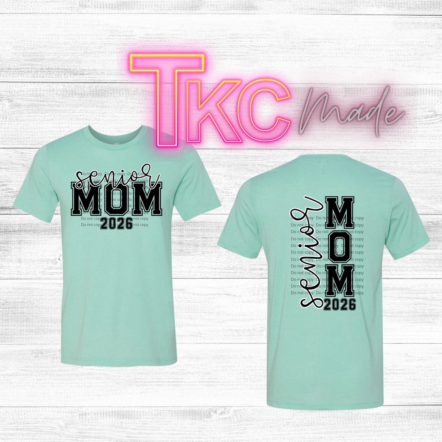 Mint green t-shirt with 'Senior Mom 2026' text on a white wooden background, featuring 'TKC Made' branding.