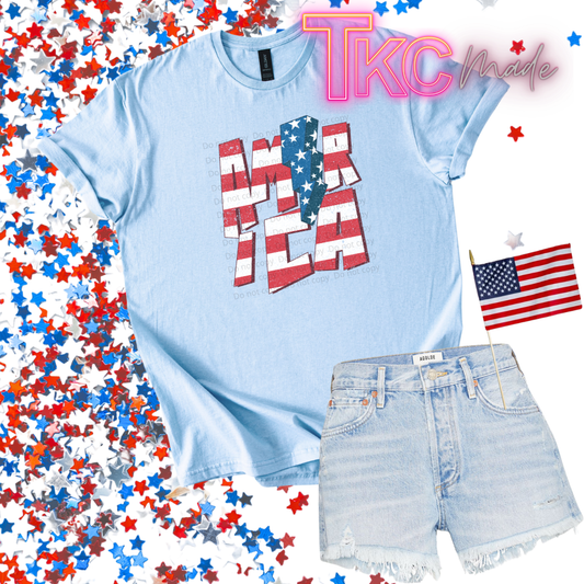 america with lighting bolt design on a light blue tee