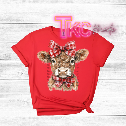 Christmas highland cow with bow