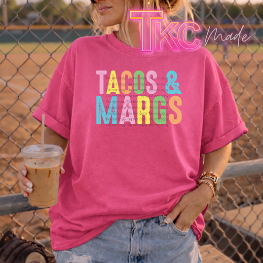 Person wearing a pink t-shirt with 'TACOS & MARGS' text, holding a drink, with 'TKC Made' branding.