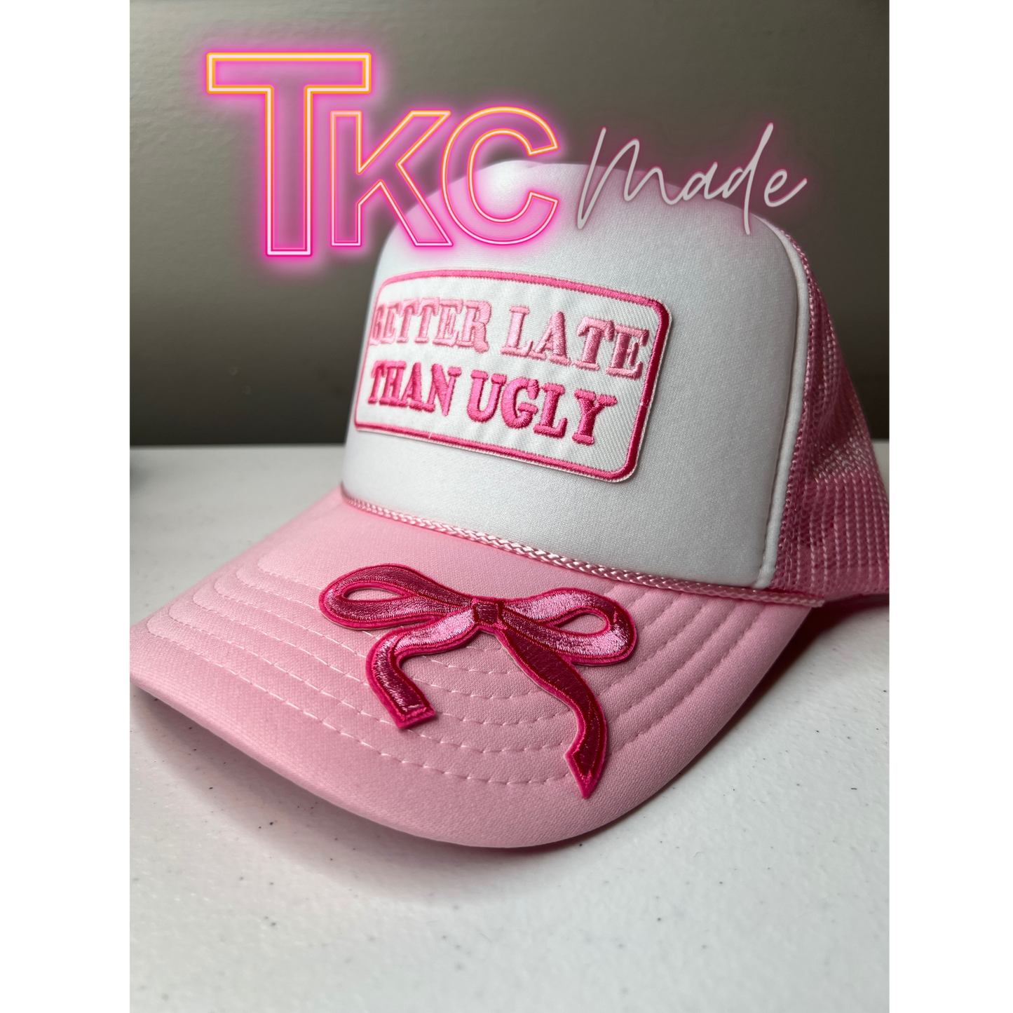 Better late than ugly coquette pink trucker hat