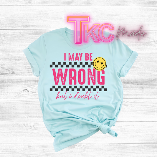 Light blue t-shirt with humorous text design on a wooden surface, featuring the brand 'TKC made'.