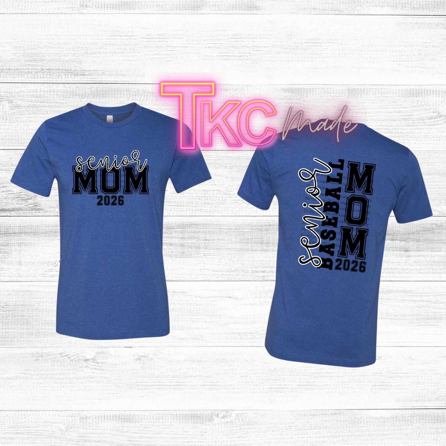 Two blue t-shirts with 'Senior Mmm 2026' and 'Senior Baseball Mom 2026' text on a white wooden background.