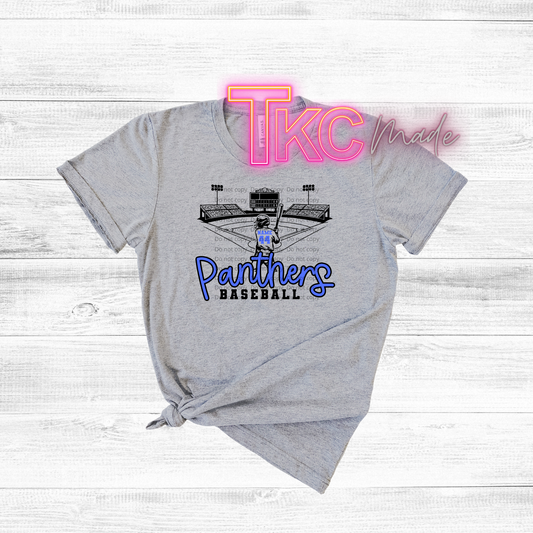 Gray t-shirt with 'Panthers Baseball' design and 'TKC' branding on a light wooden background