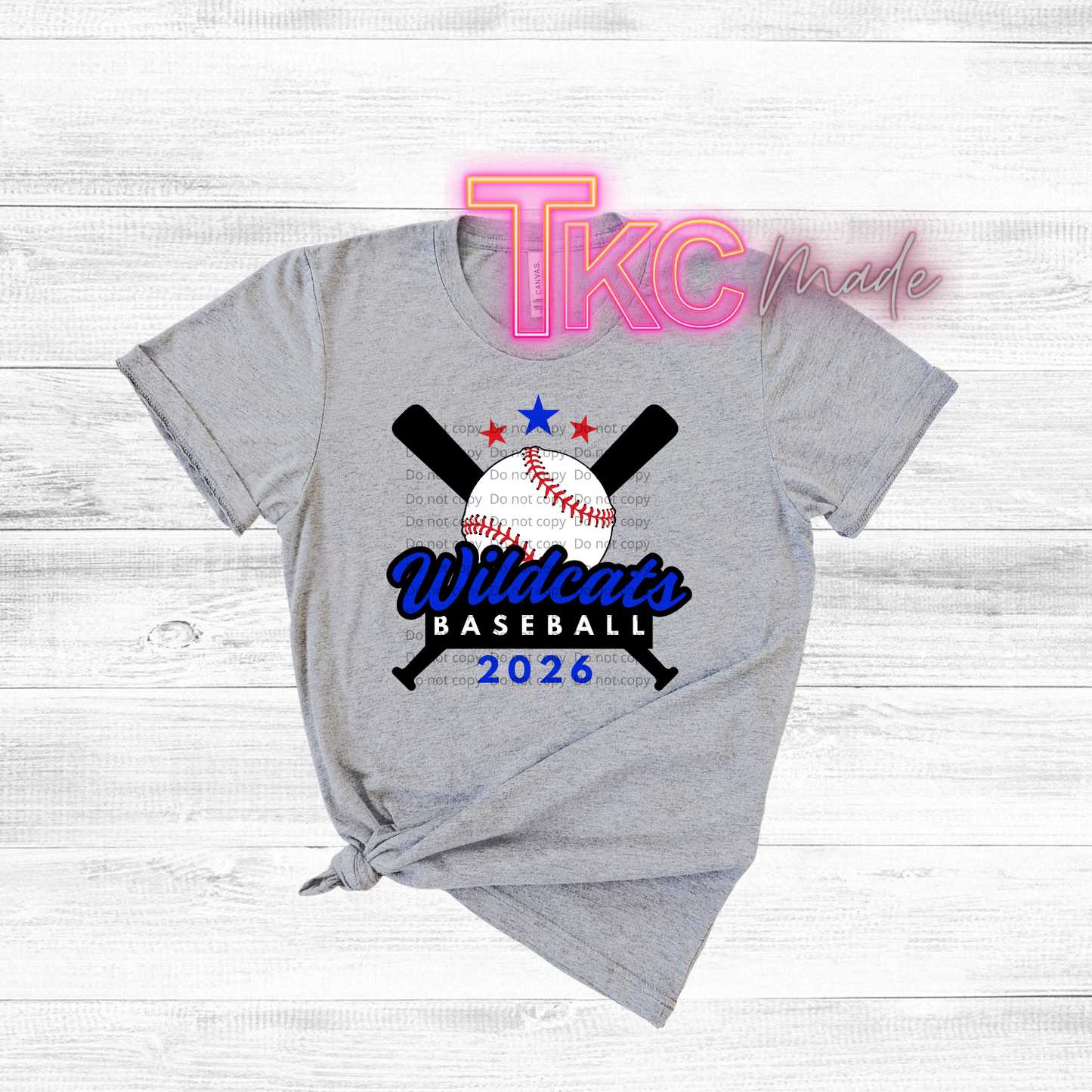 Gray t-shirt with Wildcats Baseball 2026 design on a white wooden background
