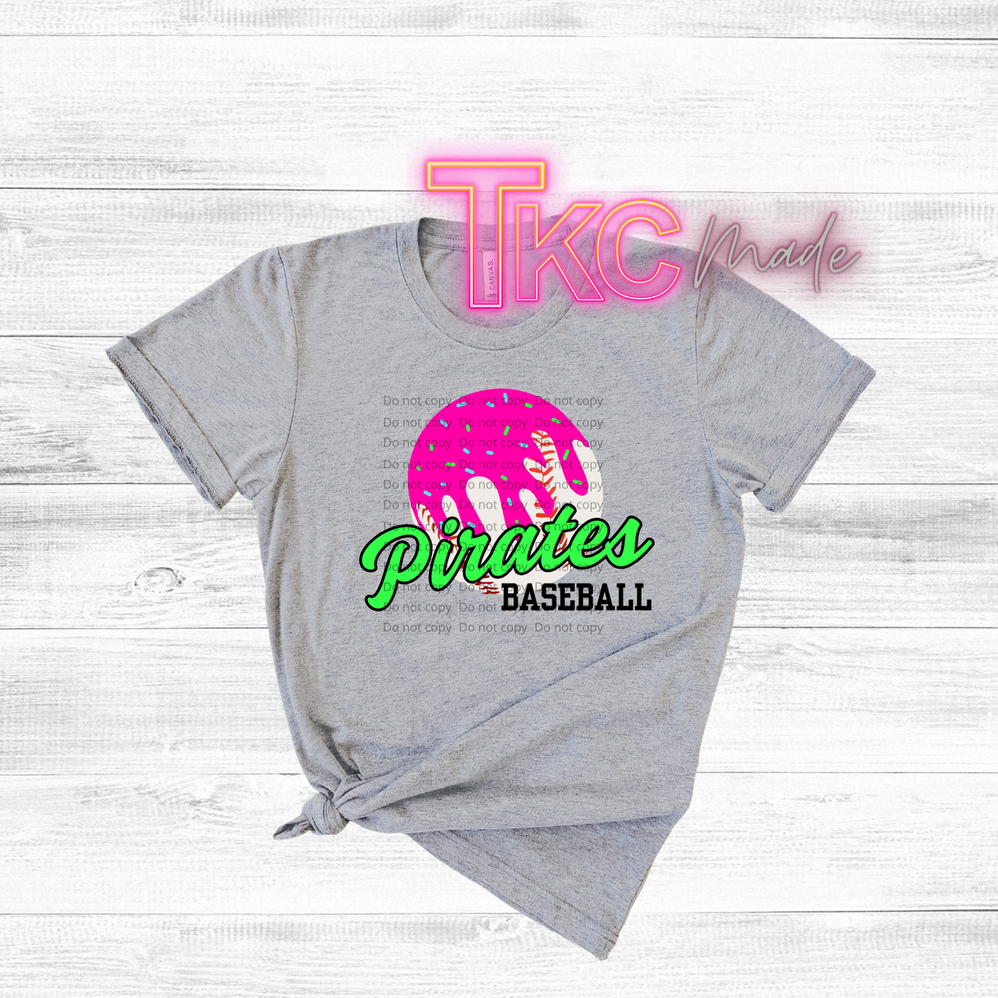 Gray t-shirt with 'Pirates Baseball' design and 'TKC made' text on a light wooden background