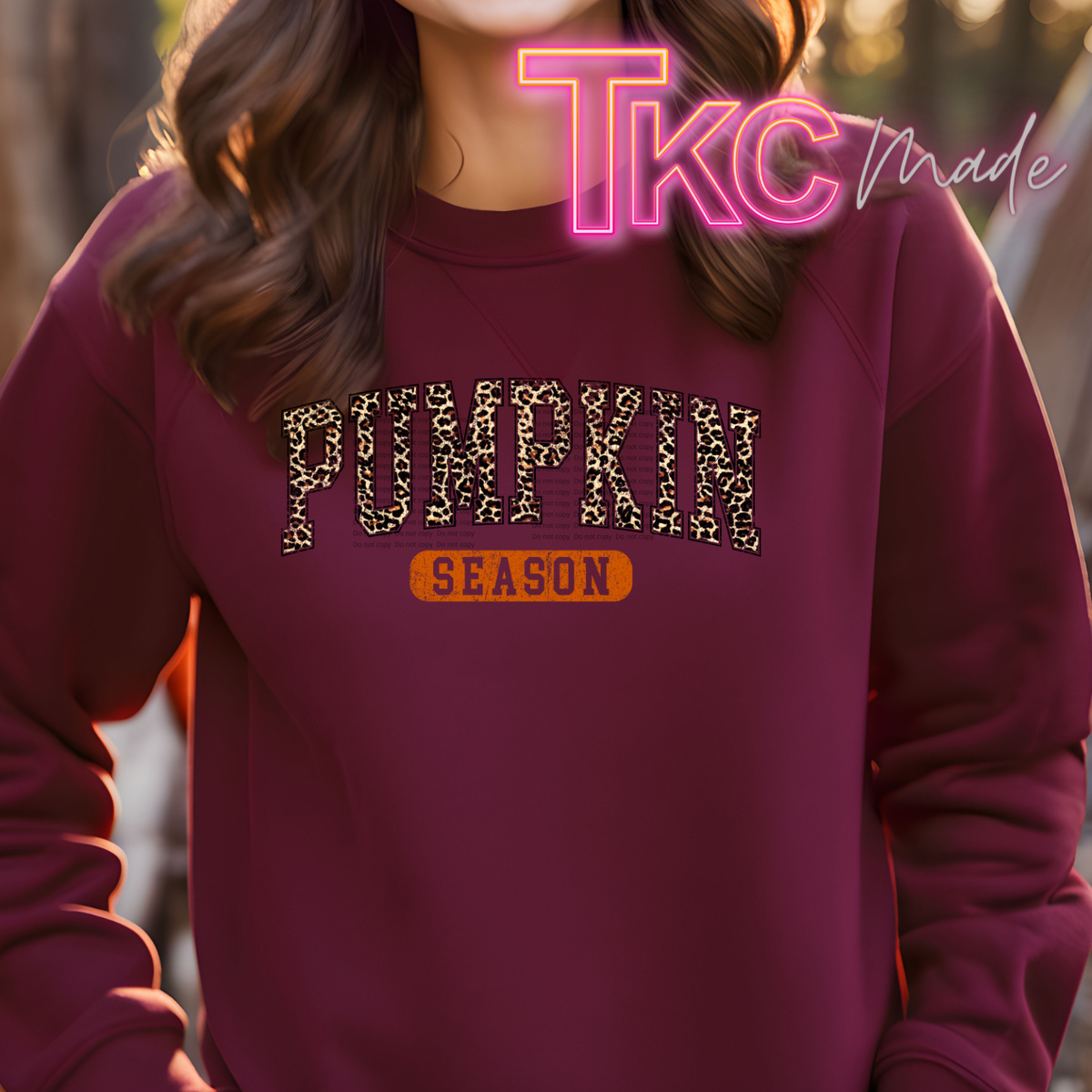 leopard pumpkin season on a maroon sweatshirt