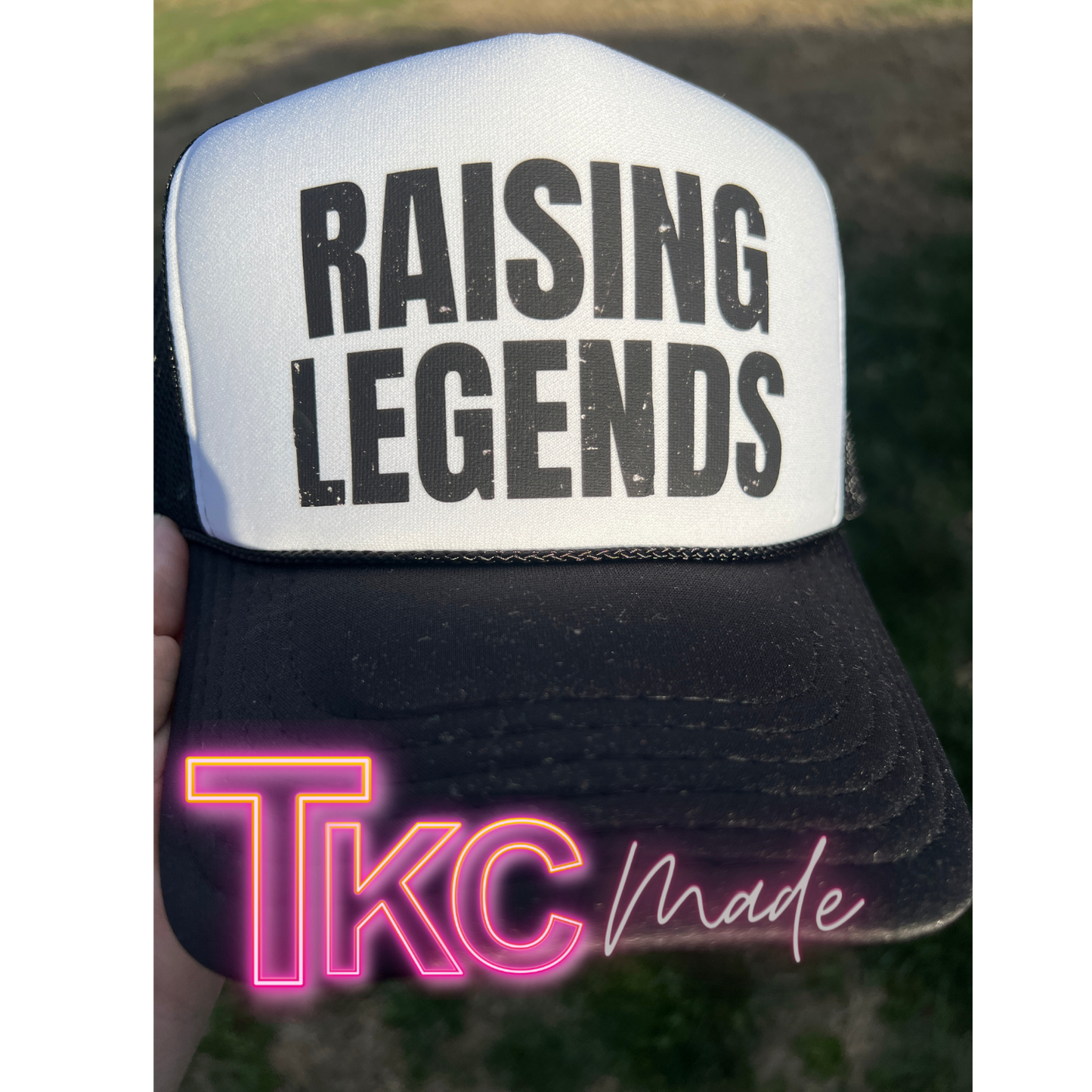 Trucker hat with 'RAISING LEGENDS' text and 'Tkcmade' branding.