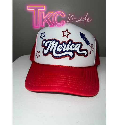 Red and white cap with 'Merica' text on a white surface, featuring 'TKC made' text in the corner.