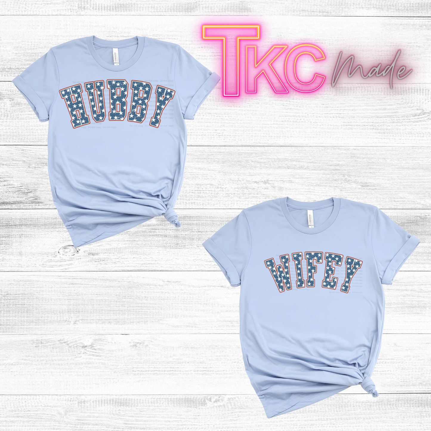 Two light blue t-shirts with 'WIFEY'  and "bubby" text on a wooden surface, featuring 'TKC Made' branding.