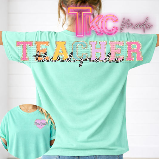 Mint green t-shirt with 'TKC Made Teacher Third Grade' text on a plain background