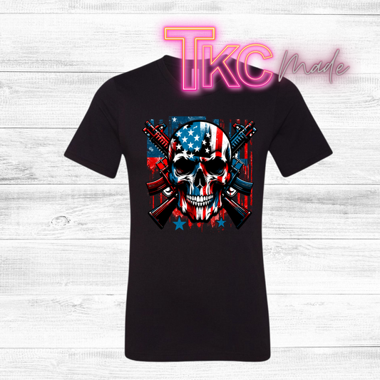 Black t-shirt with a skull and American flag design on a wooden surface, featuring 'TKC Made' branding.