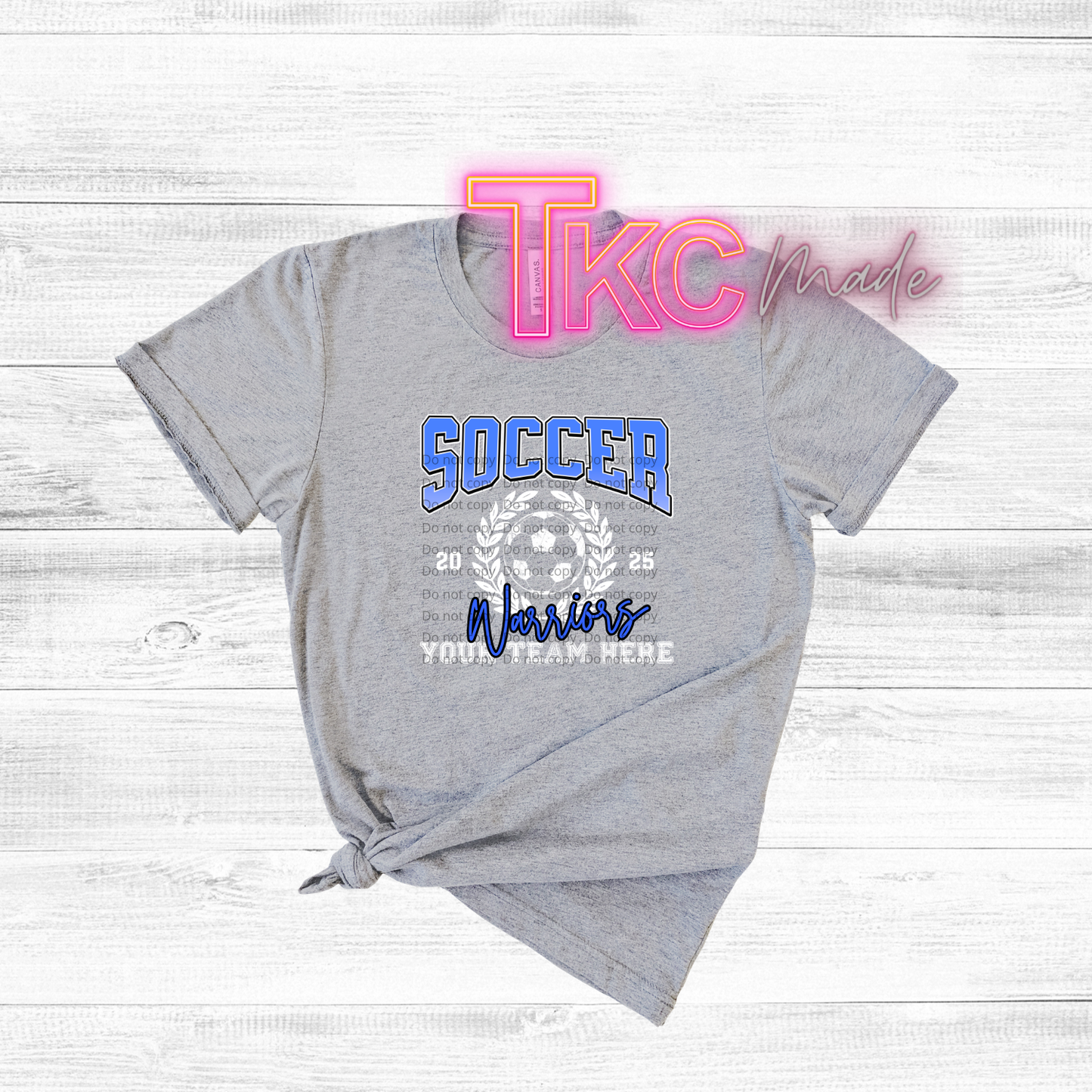 Gray t-shirt with soccer design and 'TKC made' text on a white background