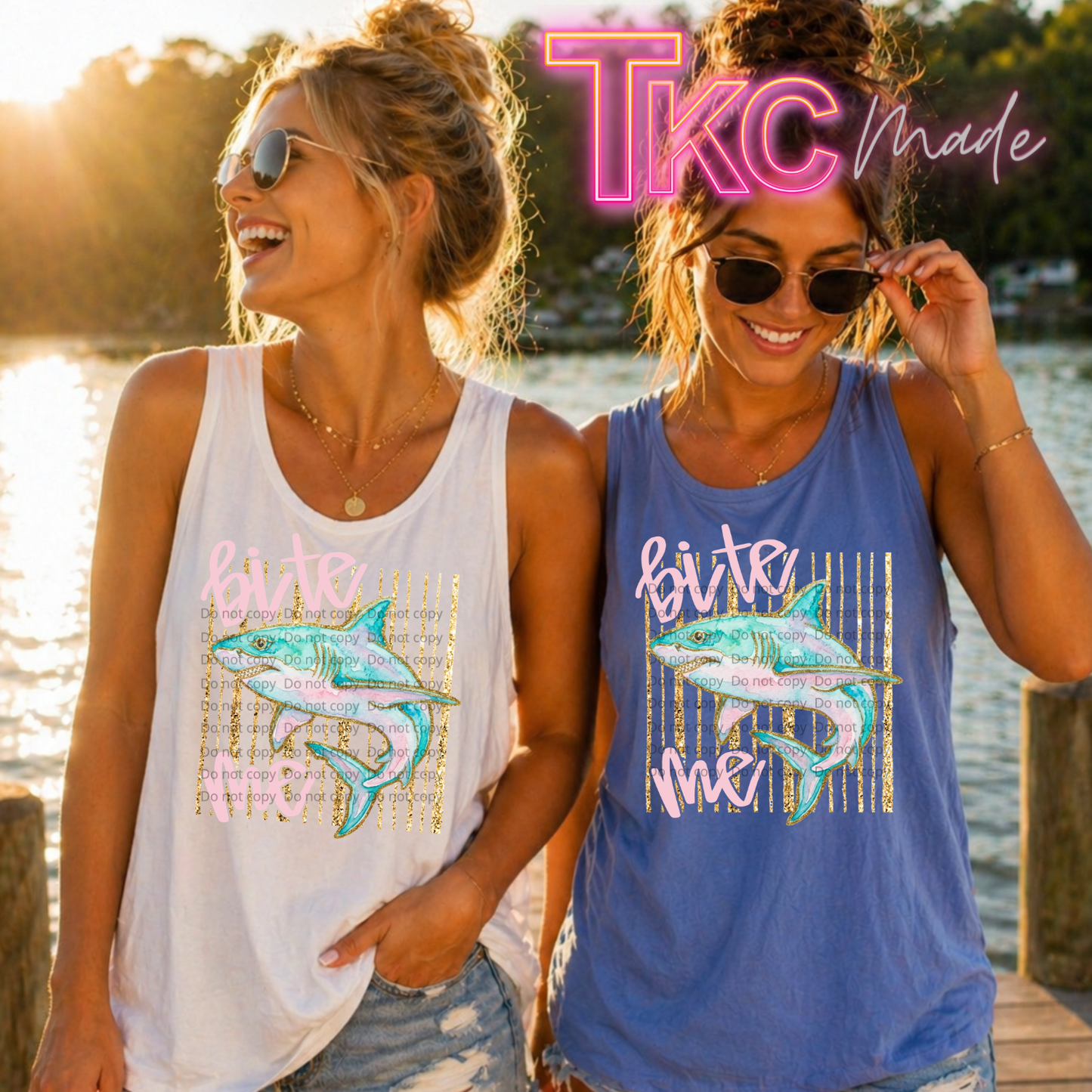 2 tank tops featuring the words bite me with a shark in between outlined in glitter with glitter stripes behind