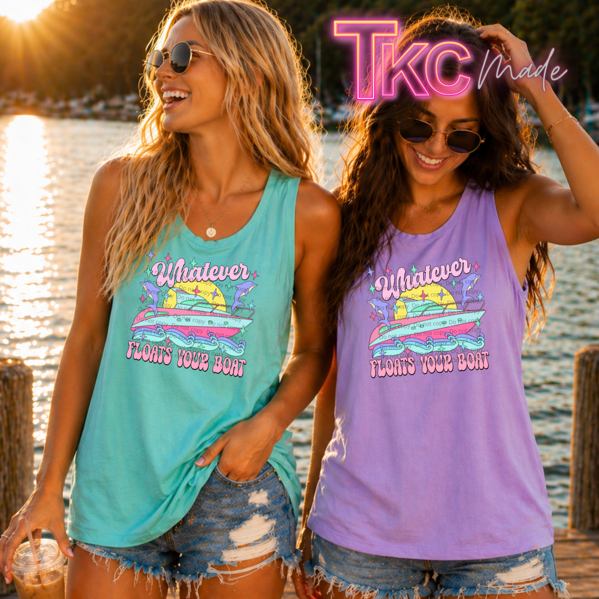Two women wearing tank tops with a lake and sunset in the background