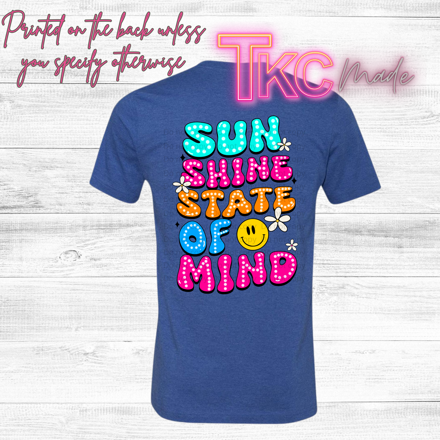 Blue t-shirt with colorful text design sunshine state of mind on a wooden background