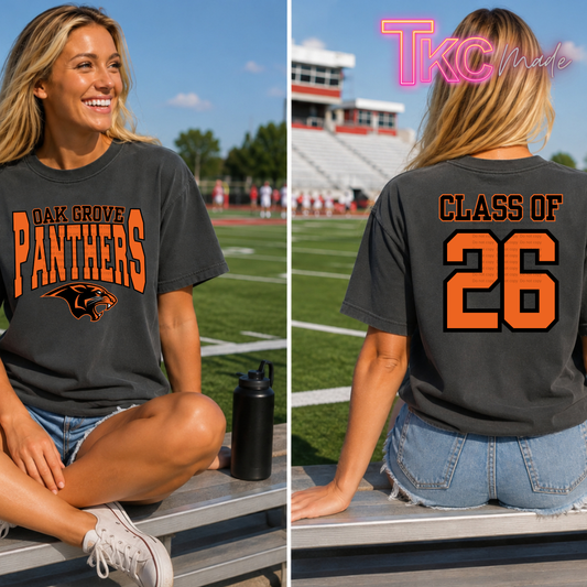girl wearing a front and back shirt. The front reads Oak Grove Panthers and the back class of 26